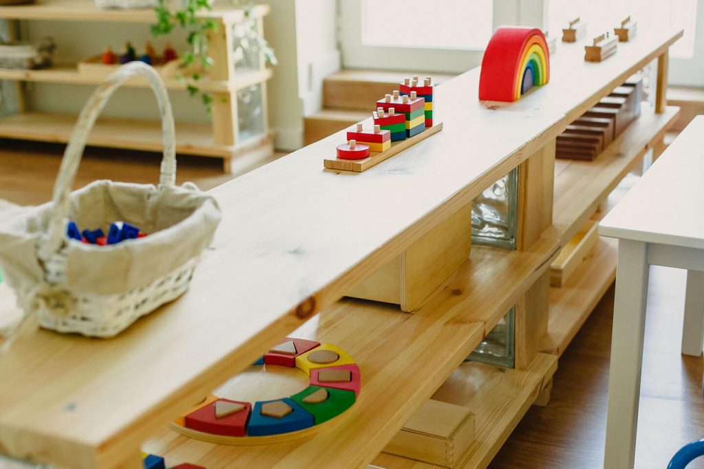 A wooden shelf with toys on it at a childcare center in Sydney's Inner West